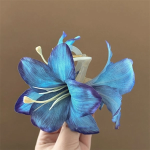 Detailed view of realistic purple lily flower hair claw clip with gradient petals