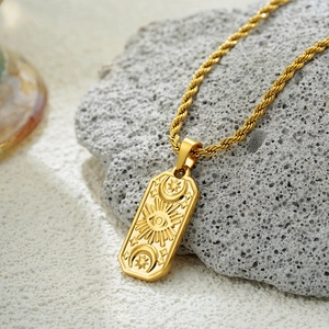 Gold 18K stainless steel rectangular evil eye pendant with twist chain on stone