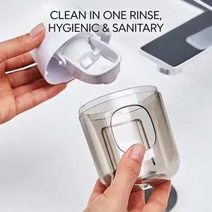 Automatic toothpaste squeezer cup holder made of durable white and smoke grey plastic