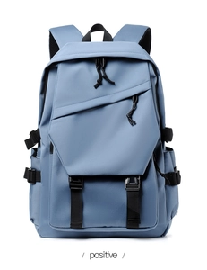 Detailed front view of a blue minimalist laptop backpack with buckle straps and zippers