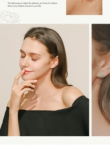 Detailed close-up of S925 silver stud earrings with light green opal and claw setting