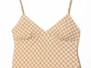 Detailed view of plaid sleeveless dress featuring seersucker texture and V-neck design