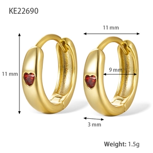 Elegant gold heart earrings with red zircon stones in a symmetrical 45-degree side view