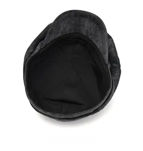 Detail view of newsboy cap interior showing cotton lining and sweatband stitching