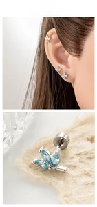 Detail of leaf-shaped cartilage stud with zircon inlay and secure screw back closure