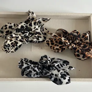 Three-piece leopard print bow hair claws in beige, brown, and black French style