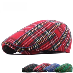 Detailed view of British newsboy cap showing classic plaid pattern and woven texture