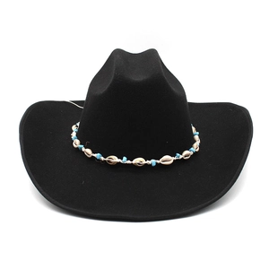 Detail of western wool fedora with shell and turquoise beaded ethnic style hatband