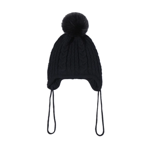 Detail of black cable knit toddler hat with soft pom-pom and earflap chin straps