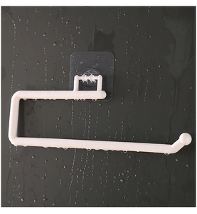 Waterproof adhesive kitchen roll holder on grey wall showing moisture resistance