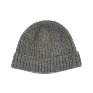 Detailed close-up showing grey ribbed knit texture and cuffed hem of the winter beanie
