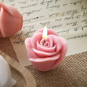 3D rose flower scented candle with layered petals on a vintage background mat