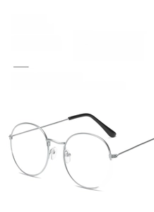 Detail of silver round metal glasses frame with black anti-slip temple tips and retro design