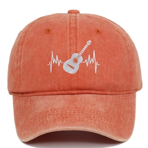 Detail of guitar heartbeat embroidery on vintage washed cotton baseball cap texture