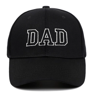 Close-up of DAD white 3D embroidery on a black cotton canvas vintage baseball cap