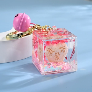 Pink heart liquid acrylic keychain with sequins and I Love You engraving for couples