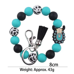 Silicone cow print beaded keychain bracelet with western bull charm and black tassel