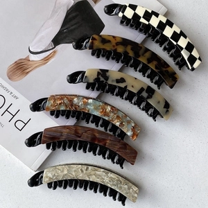 Detailed set of leopard print and tortoiseshell acetate banana hair clips for thick hair