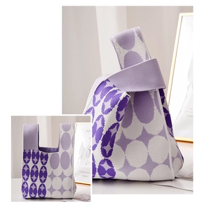 Detailed close-up of purple and white geometric knit handbag showing fine fabric texture
