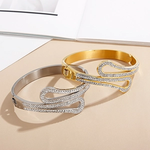 Polished gold and silver titanium steel open bracelets with sparkling zircons