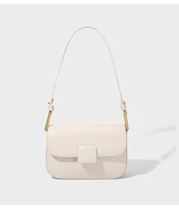 Detail view of the sleek gold metal buckle and refined PU leather texture on the beige bag