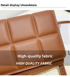 Detailed view of caramel quilted leather texture and premium stitching on the shoulder bag
