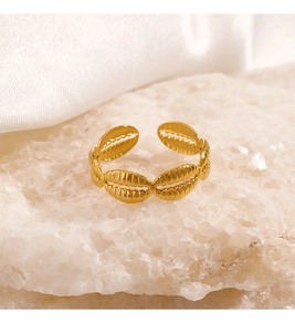 Detailed view of adjustable gold-plated stainless steel ring with conch shell textures