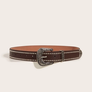 Vintage brown leather belt with silver studs and engraved Western buckle on beige background