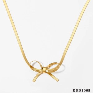 Elegant gold-tone bow pendant necklace with a sleek snake chain on a white background