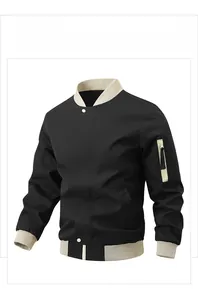 Detail of color-block bomber jacket featuring ribbed collar and contrast sleeve pocket