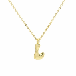 Macro detail of polished 3D balloon letter L pendant on a delicate gold chain necklace