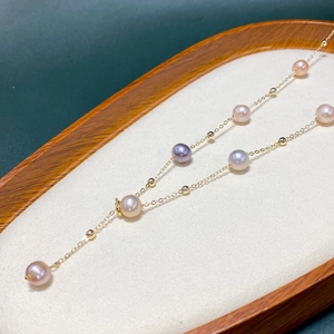Macro detail of multi-color freshwater pearl necklace with 14K gold-filled adjustable chain