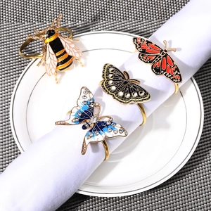 European insect-shaped napkin rings with gold metal finish and colorful enamel detailing