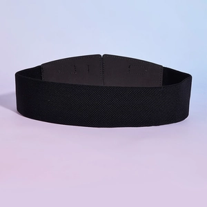 Detailed view of the black elastic waist belt with textured gray faux leather buckle
