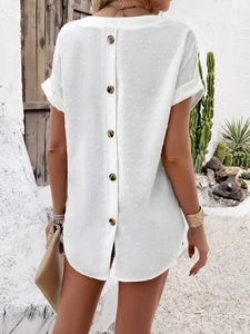 Detail of white shirt with dot texture and brown buttons on the back view