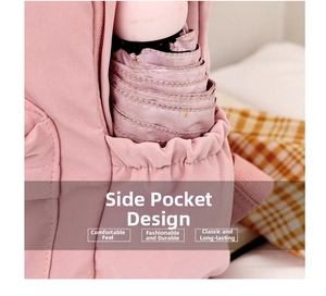 Detailed close-up of pink backpack side pocket with elastic opening for folding umbrellas