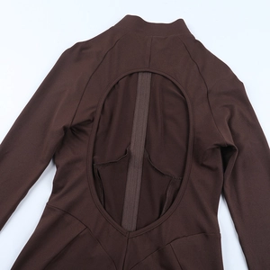 Detail view of coffee brown jumpsuit with deep oval back cutout and vertical strap detail