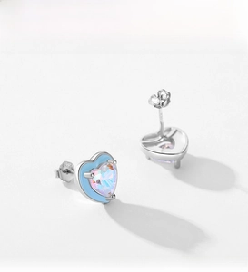 Detail view of heart-shaped S925 silver studs with blue enamel and colorful cubic zirconia