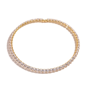 Macro shot of gold plated necklace featuring heart-shaped cubic zirconia crystals