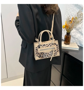 Chic leopard print panel bag styled with a black blazer for a modern fashion look