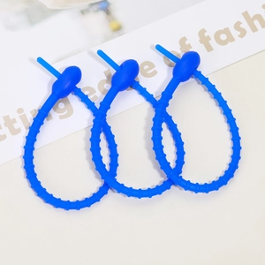 Three blue adjustable silicone cable ties for organizing wires and accessory hanging