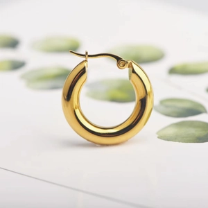 Polished 18K gold chunky hoop earrings in a minimalist stainless steel hollow design