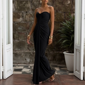 Close-up of ruched black strapless dress featuring premium elastic pleated fabric details