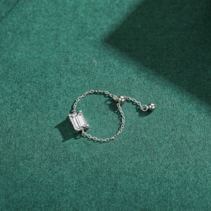 Minimalist S925 sterling silver chain ring with a rectangular cubic zirconia on green background