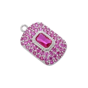 Detail of silver rectangular pendant featuring a large pink crystal and pavé border
