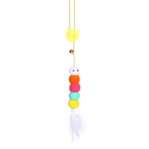 Hanging cat toy with colorful plush balls, feathers, and bell on a yellow elastic string
