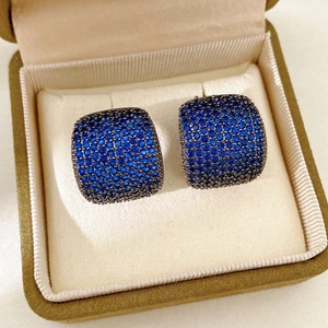 Vintage-style square earrings with blue zircon in gunmetal setting on velvet gift box