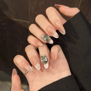 Elegant cat-eye gradient almond press-on nails with rhinestone accents in soft pink