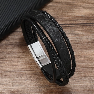 Detailed view of multilayer black woven leather bracelet with silver magnetic alloy clasp