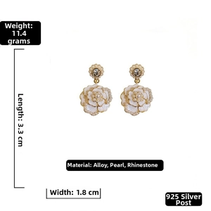 Detail view of retro camellia flower earrings with pearls and silver pins 3.3cm long